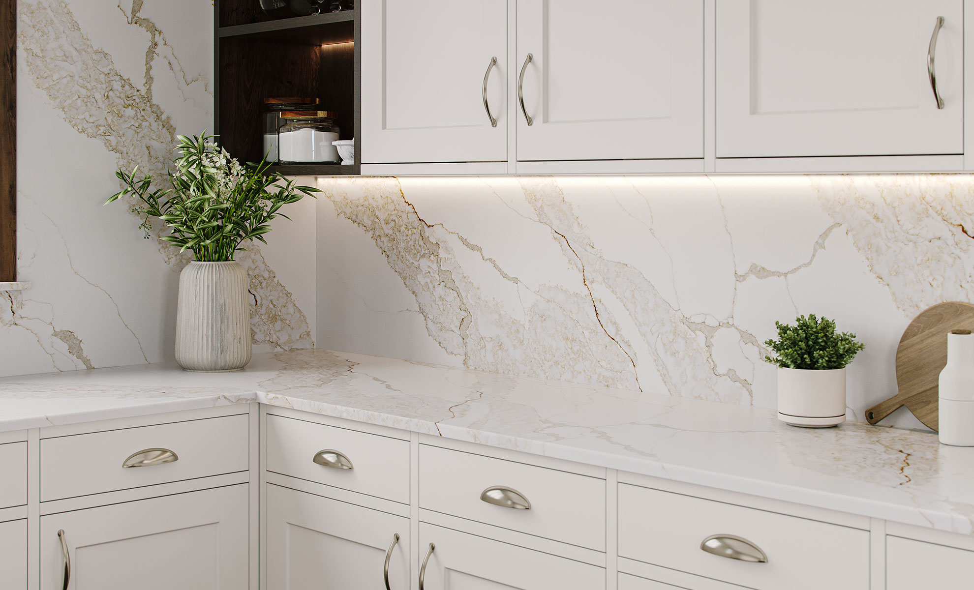 This image depicts a stylish kitchen with gold-veined quartz kitchen countertops and a matching backsplash, creating a luxurious look